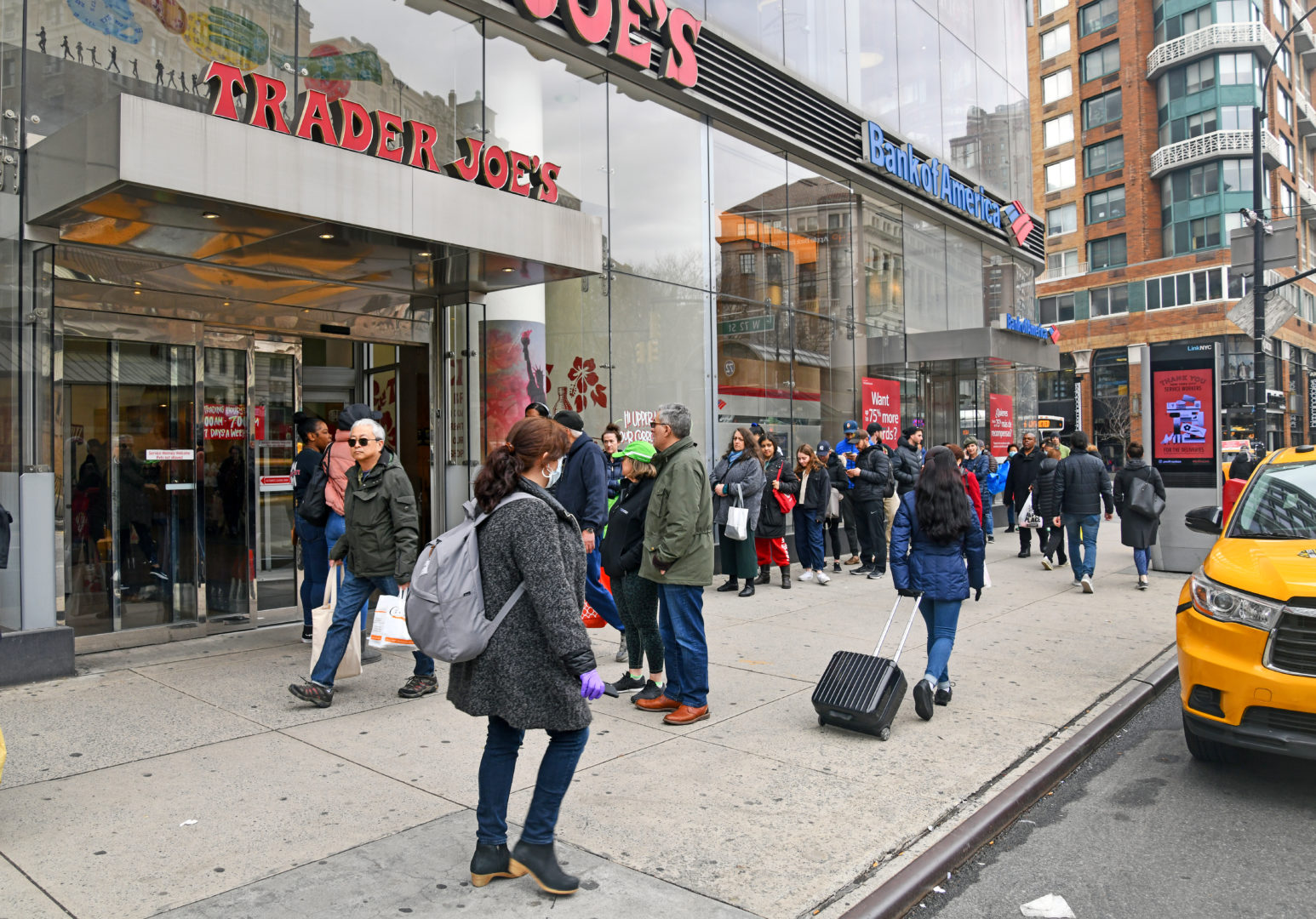 NEW YORK CITY CIRCA MARCH 2020. As the coronavirus pandemic broadens in scope, grocery stores such as Trader Joe’s are seeing long lines of people stocking up on food and provisions